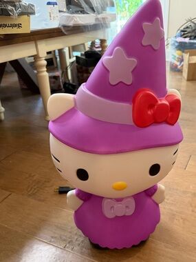 Hello Kitty Purple Witch Dress Figurine with Red Bow